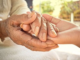 Age Pension Assistance icon with hand holding money