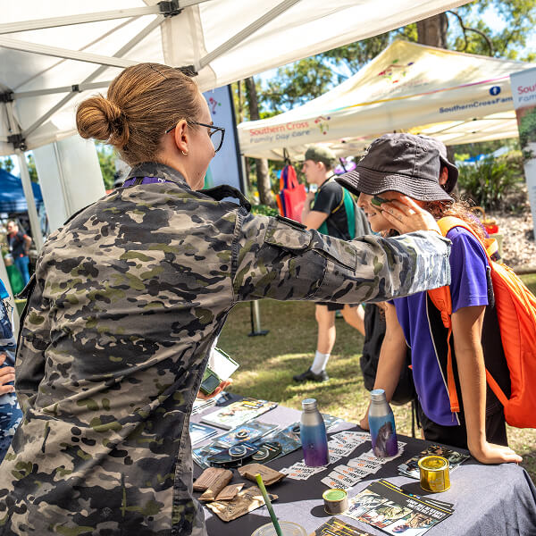 Kid gets paint on face at Dorrie Day expo